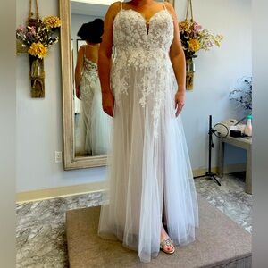 Wedding dress, size 16. Wore once. Already has the bustle.